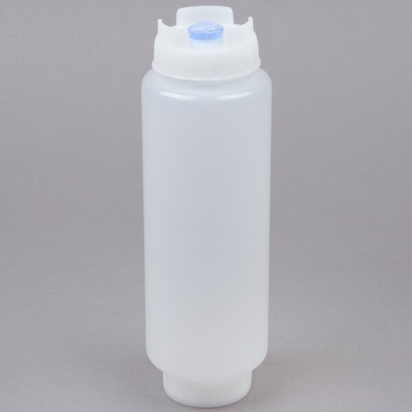 A white plastic squeeze bottle with a blue cap.
