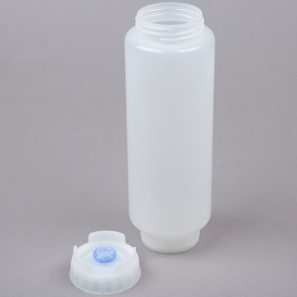 A white plastic bottle with a blue cap with a thick valve.