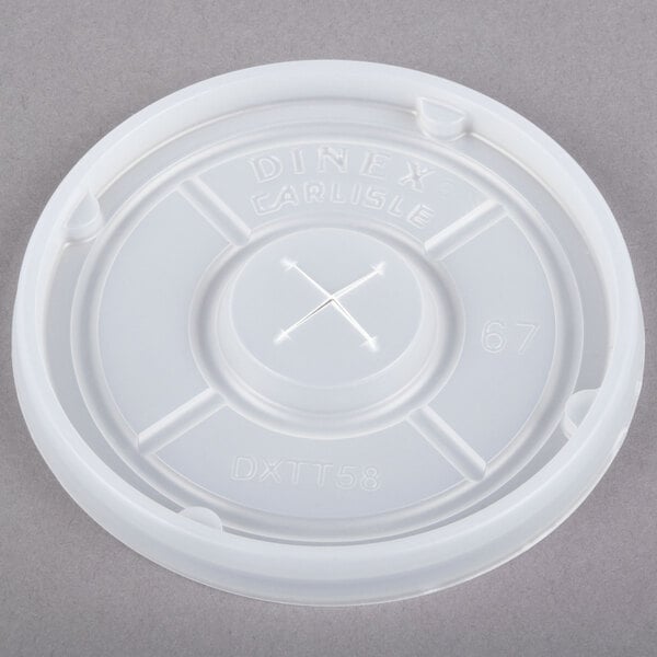 A white plastic Dinex lid with a straw slot.