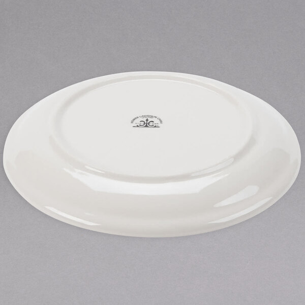 A white Homer Laughlin ivory coupe china plate.