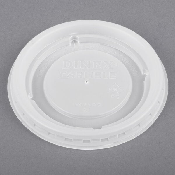 A white Dinex plastic lid with a translucent lid on it.