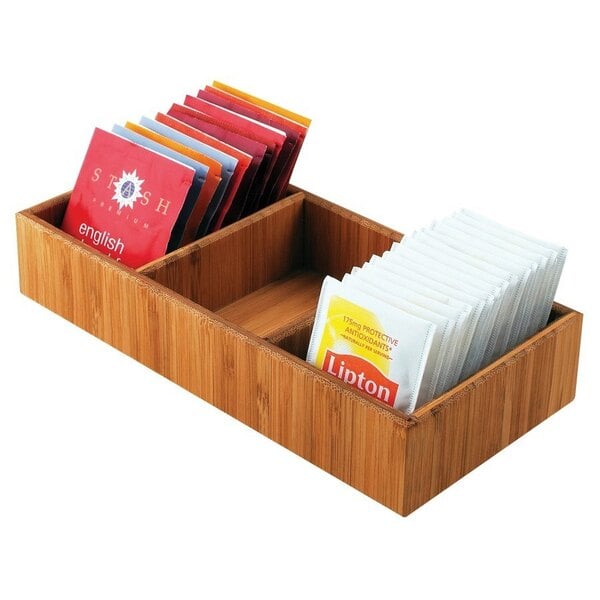 a wooden box with tea bags in it