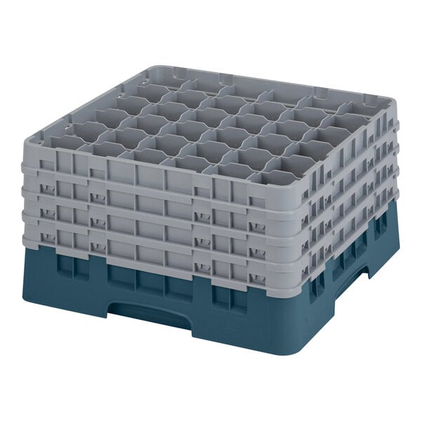A teal plastic Cambro glass rack with 36 compartments.