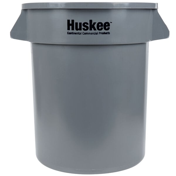 A gray plastic Continental Huskee trash can with a logo.