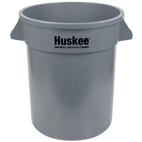 A gray plastic Continental Huskee trash can with handles.