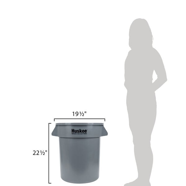 A woman standing next to a Continental grey round trash can.