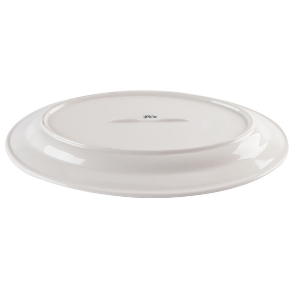 An ivory CAC oval china platter with a wide, round edge.