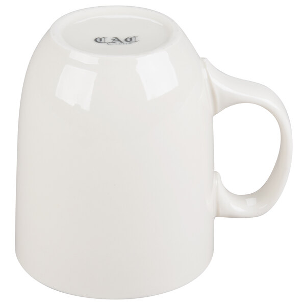 A close up of a white CAC China mug with a handle.