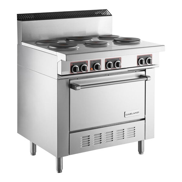 A commercial stainless steel electric restaurant range with four sealed burners and a standard oven.