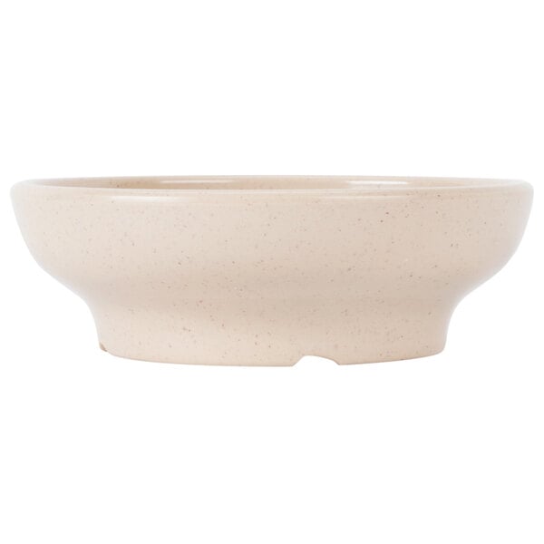 A beige speckled melamine bowl.
