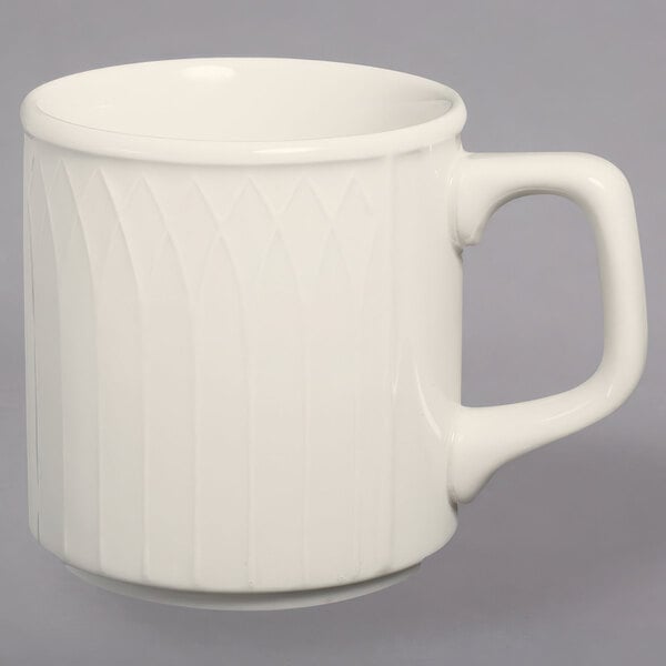 A Homer Laughlin ivory stackable china mug with a handle.