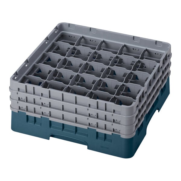 A teal plastic Cambro glass rack with 25 compartments and 3 extenders.