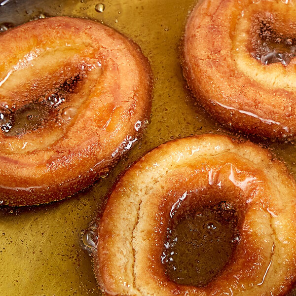 Donuts being fried in palm oil