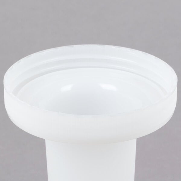 A close-up of a white plastic container with a lid on top.