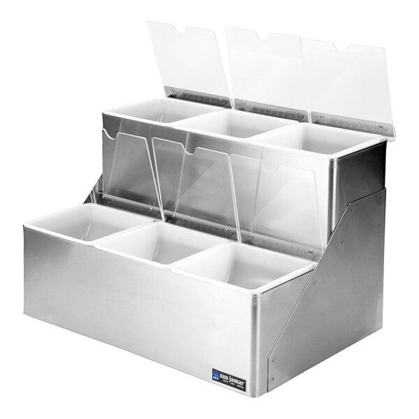 A stainless steel San Jamar condiment bar with split notched lids over four plastic bins.