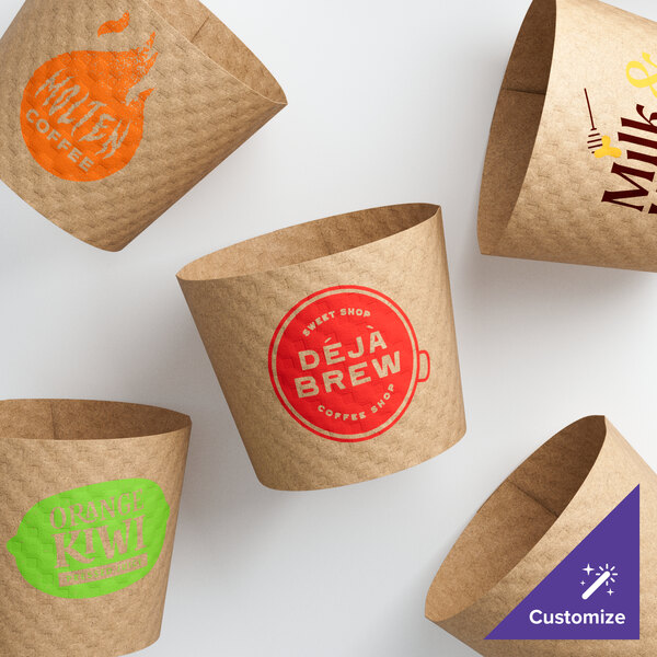 A group of 10-24 oz. natural Kraft customizable embossed coffee cup sleeves with brown designs.