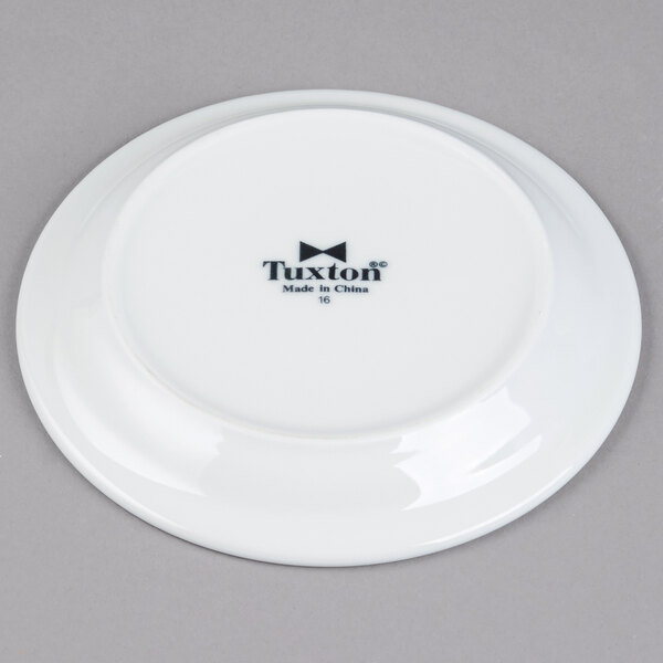 A white Tuxton Colorado narrow rim china plate with black text reading "Colorado" on it.