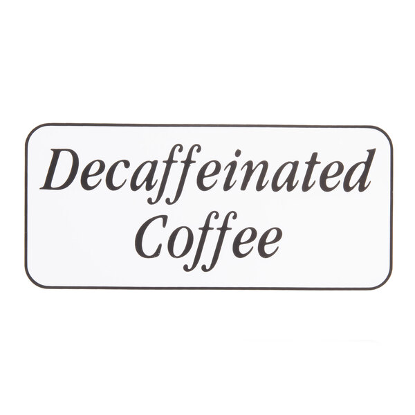 A close-up of a black "decaffeinated coffee" sign on a counter using Cambro Large Labels.