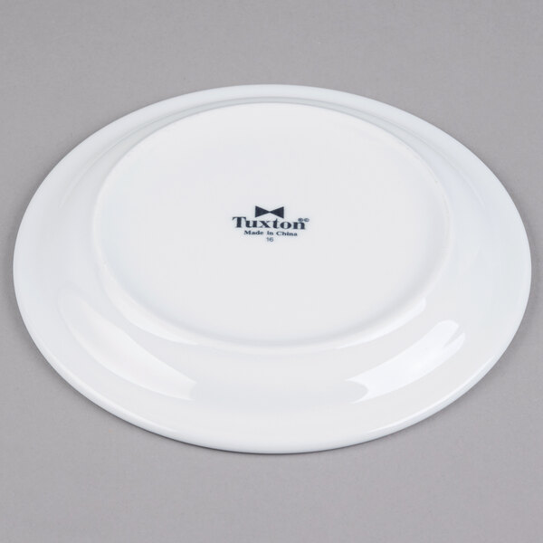 A Tuxton Colorado white china plate with black text on it.
