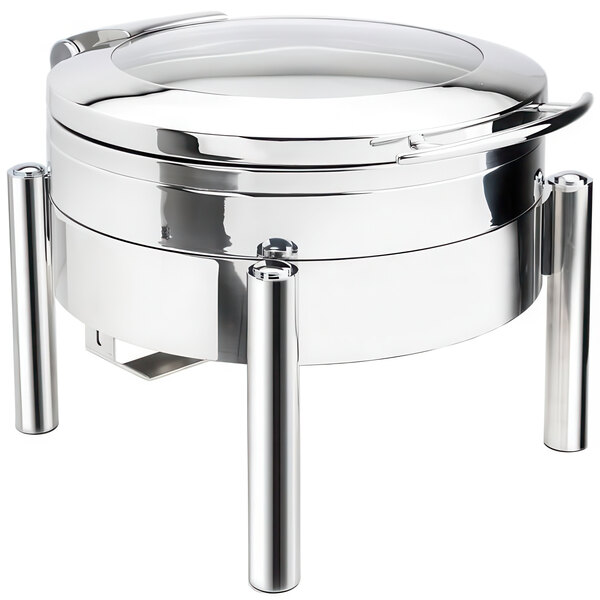 A silver stainless steel Eastern Tabletop Jazz Swing chafer with a hinged glass lid on a table.