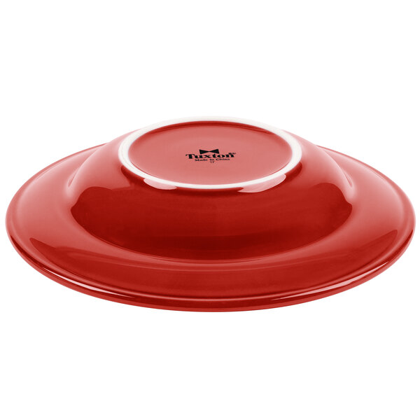 A red bowl with a white rim.