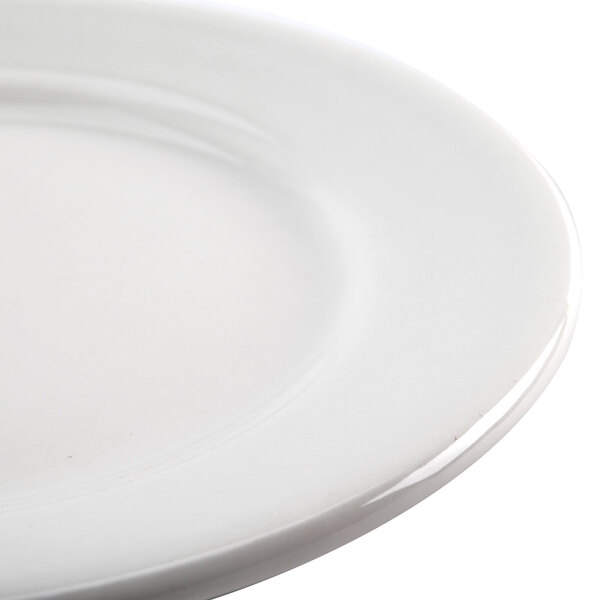 A close-up of a Homer Laughlin Pristine Ameriwhite bright white china plate with a white rim.