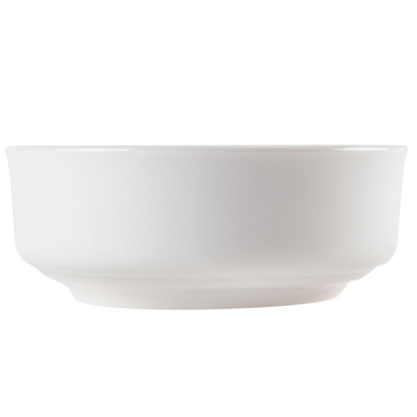 A white bowl sitting on a table.