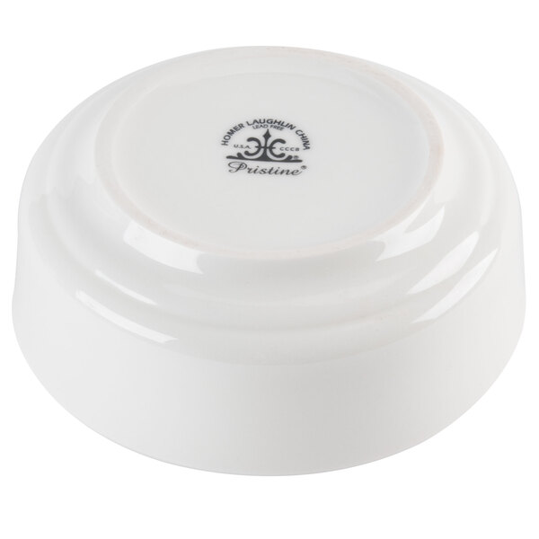 A white Homer Laughlin China nappie bowl with a black logo on it.