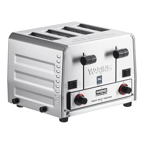 A silver Waring commercial toaster with four black slots on a counter.