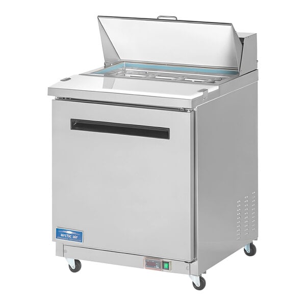 An Arctic Air stainless steel refrigerated sandwich prep table with a glass door.