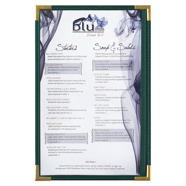 A Menu Solutions green menu board with gold corners on a counter.