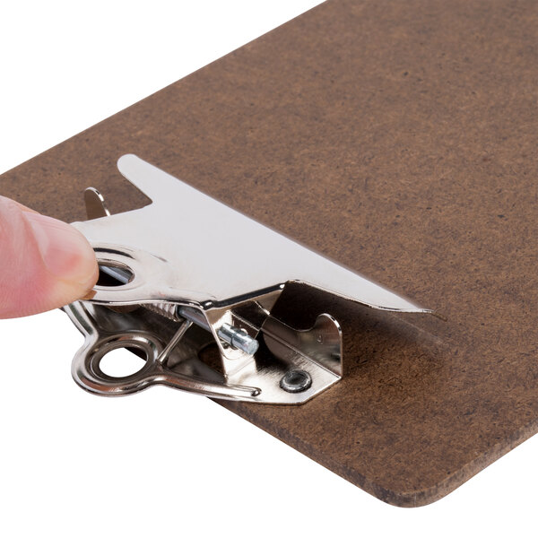 Menu Solutions dark brown menu clipboard with a metal clip held by a person.