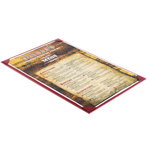 A burgundy Menu Solutions menu board on a white table.