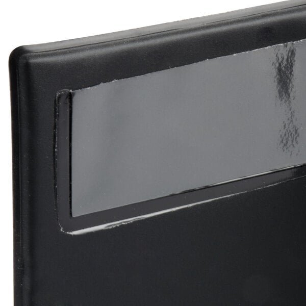 A black Menu Solutions guest check presenter.