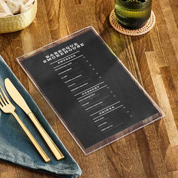 A clear menu cover on a table in a farm-to-table restaurant.