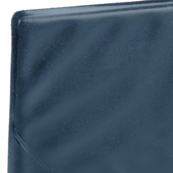A blue and blue leather Menu Solutions guest check presenter.