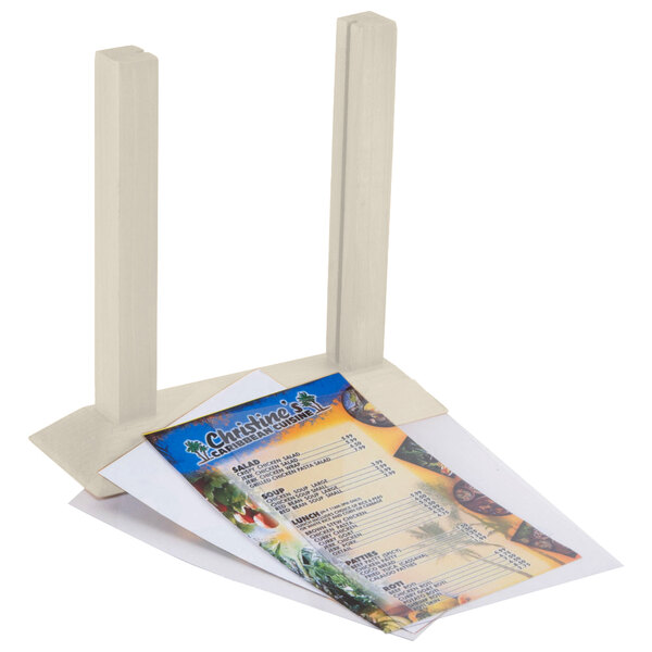 A Menu Solutions wood table tent holding a menu on a table.