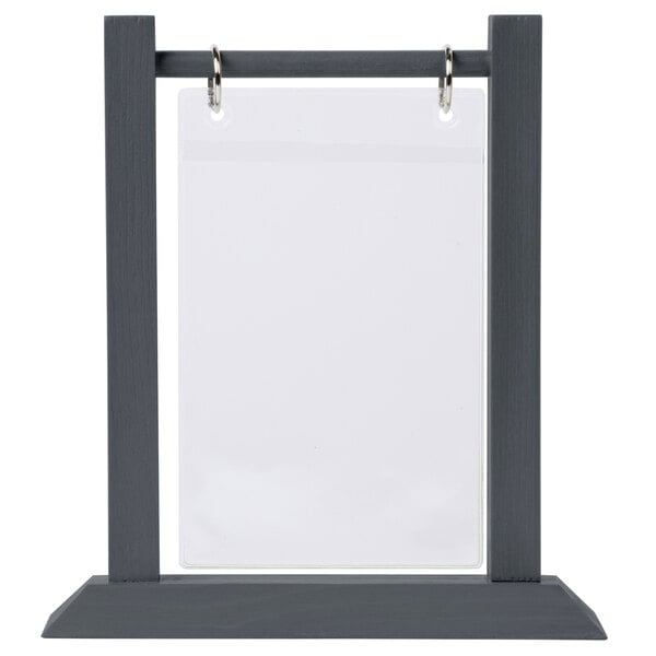 A grey rectangular ash wood table tent with a white paper inside.