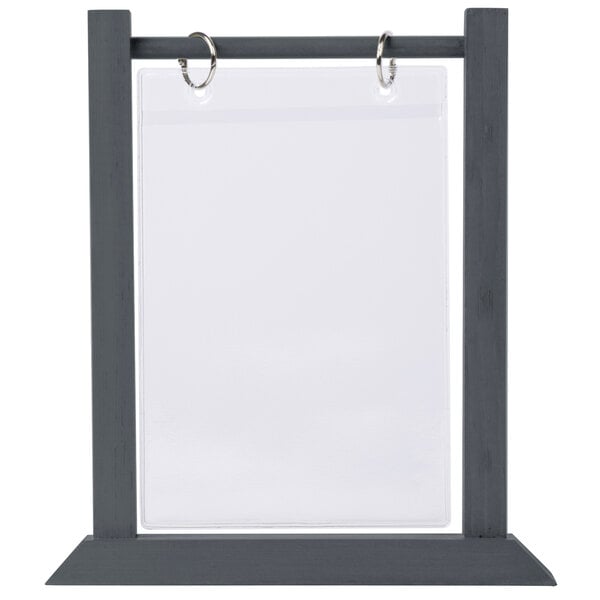 A black ash wood table tent with a metal frame for holding menus.