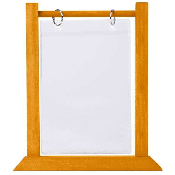 An oak wood flip top table tent with a white sign in it.