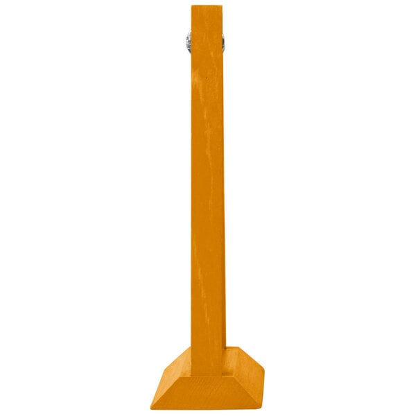 A yellow wooden Menu Solutions table tent with white borders on a wood table.