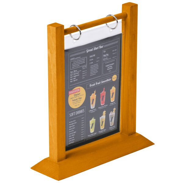 A Menu Solutions oak wood flip top table tent on a table.