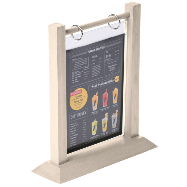 A Menu Solutions almond wood flip top table tent holding a menu.