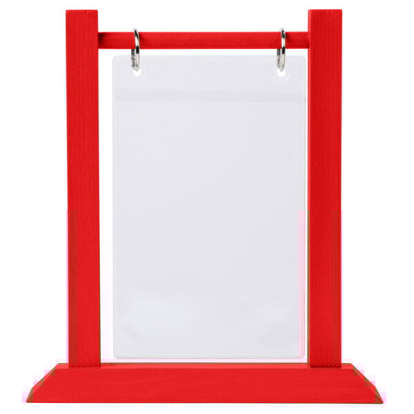 A red wood table tent with a white plastic sheet and rings.