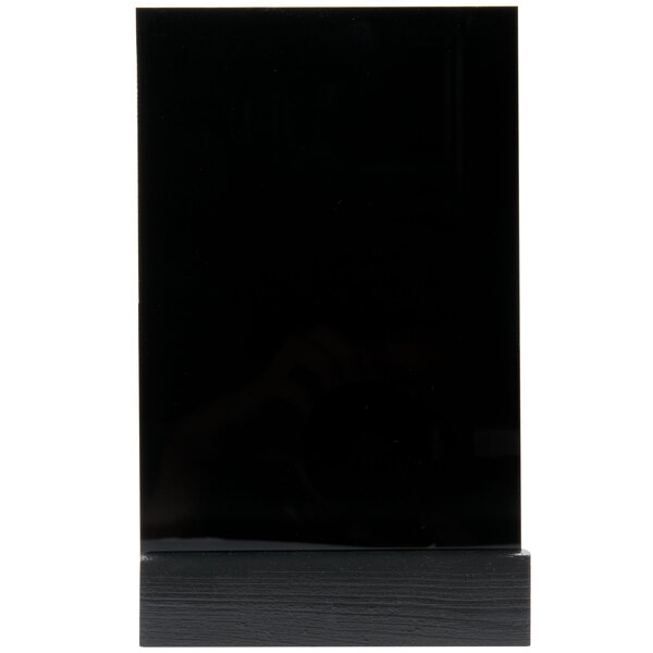 A black rectangular object with a wooden base.