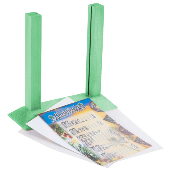 A teal wooden table tent holding a menu.