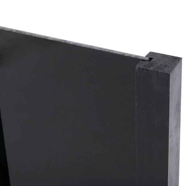 A black rectangular Menu Solutions table sign board with a white background.