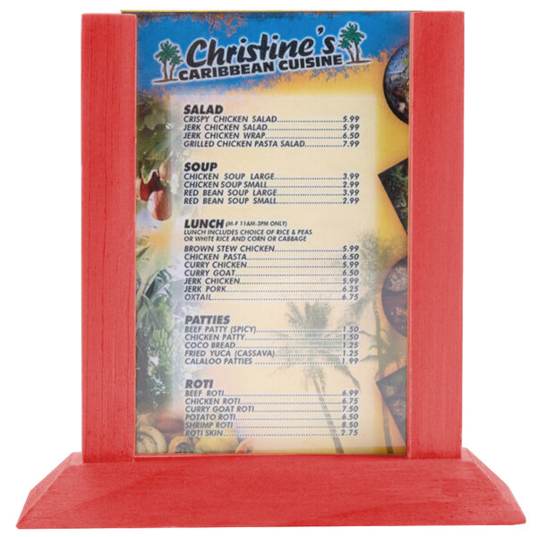 A Menu Solutions berry wood table tent holding a menu on a red table.