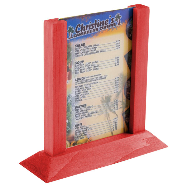 A Menu Solutions berry wood table tent with a menu on it.