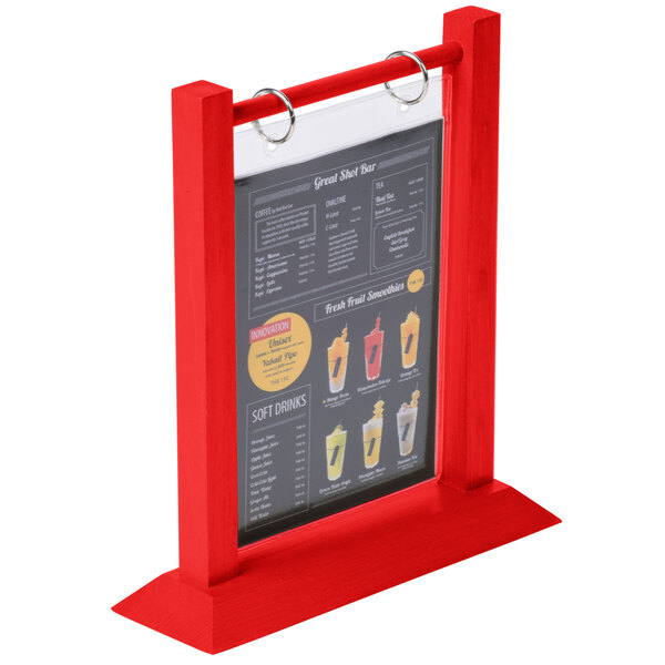 A Menu Solutions berry wood flip top table tent with a plastic sheet and rings holding a menu on a table.